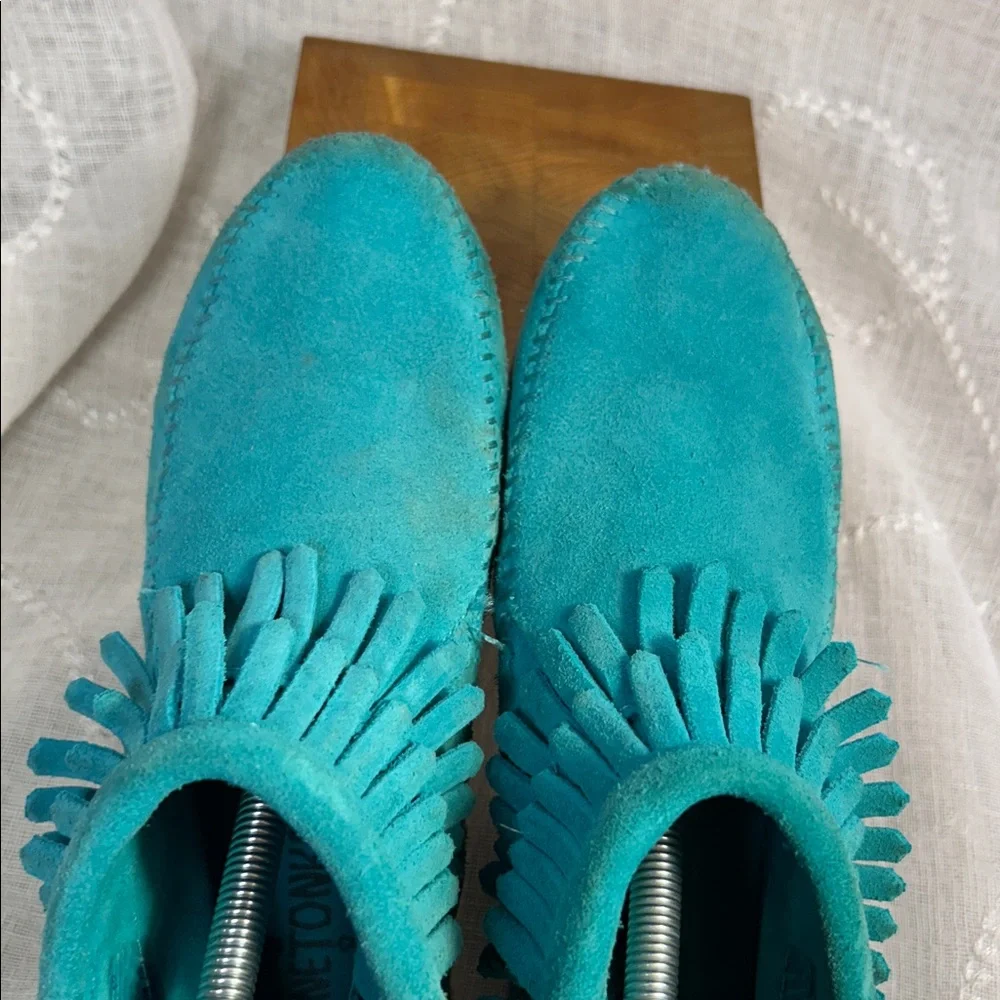 Minnetonka leather fringe moccasins with side zipper